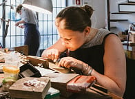 Girl making medical bracelet