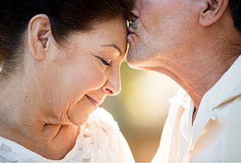 Husband kissing wife